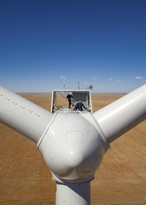 Technician working on wind turbine.
